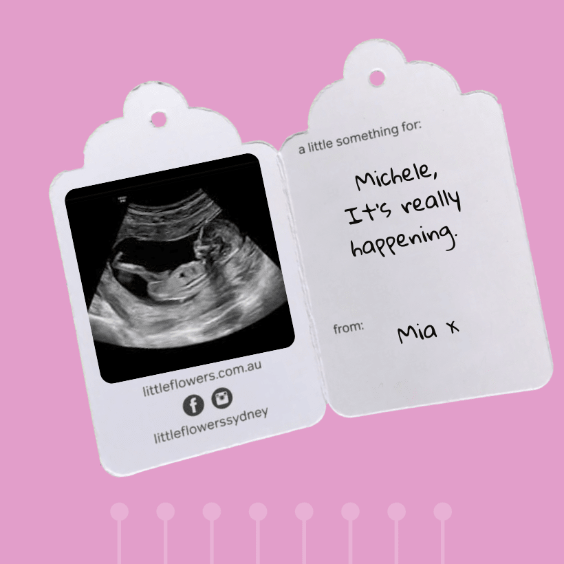 Flowers delivered with pregnancy announcement card